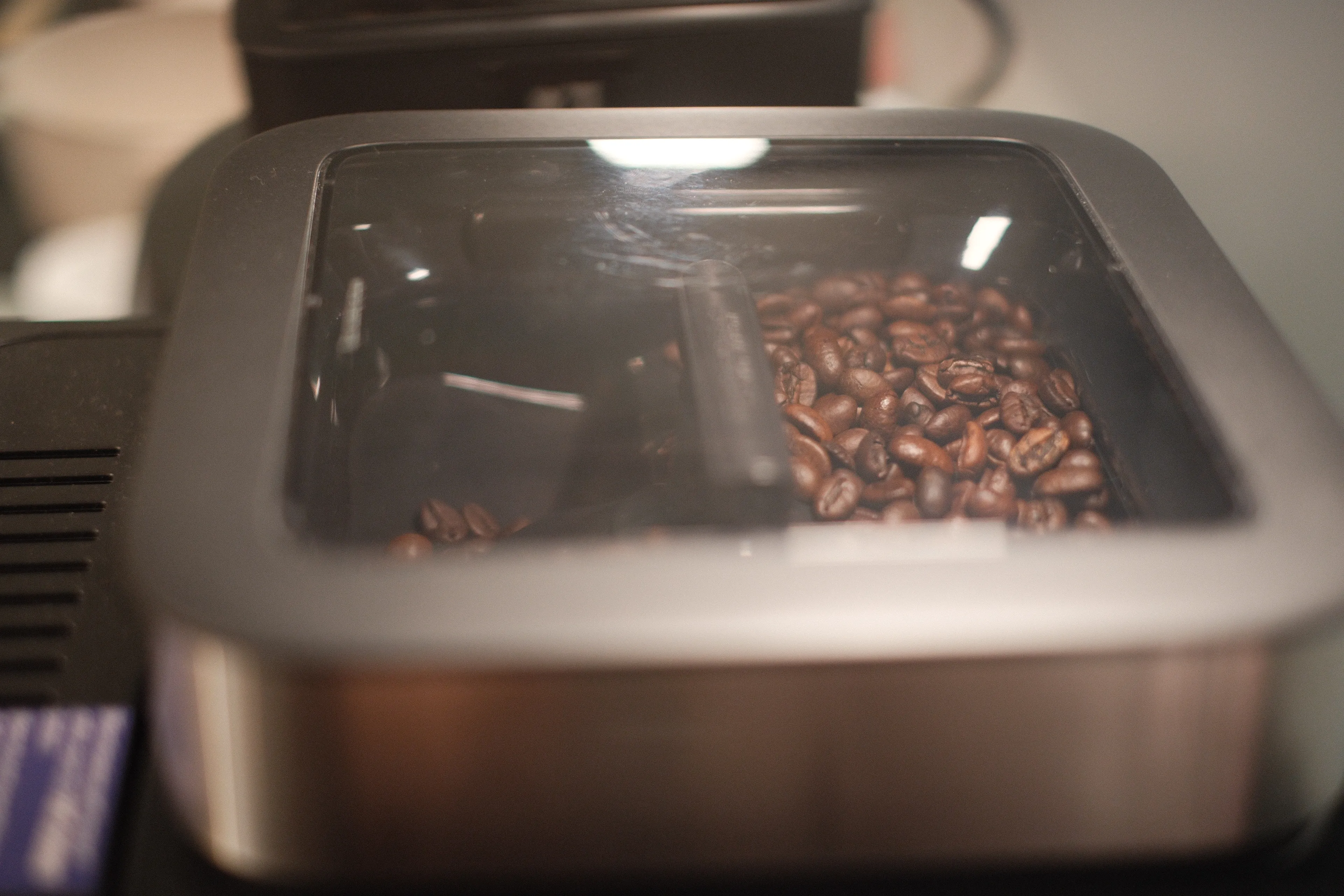 The bean hopper — I keep one for regular and one for decaf